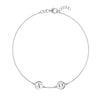 14k white gold cable chain bracelet featuring two 1/4” flat engraved letter discs, spelling XO