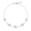 14k white gold cable chain bracelet featuring five 1/4” flat engraved letter discs, spelling NONNA