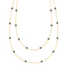 Bayberry Birthstone Wrap necklace featuring 4 mm briolette cut sapphires bezel set in 14k yellow gold - front view