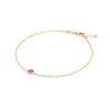 Classic cable chain bracelet featuring one briolette cut amethyst bezel set in 14k yellow gold - angled view