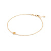 Classic cable chain bracelet featuring one 4 mm briolette cut citrine bezel set in 14k yellow gold - angled view