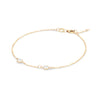 Personalized cable chain bracelet featuring two 4 mm briolette cut gemstones bezel set in 14k yellow gold - angled view