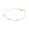 Bayberry cable chain birthstone bracelet featuring three 4 mm briolette aquamarines bezel set in 14k gold - angled view