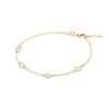 Personalized cable chain bracelet featuring four 4 mm briolette cut gemstones bezel set in 14k yellow gold - angled view