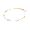 Personalized cable chain bracelet featuring five 4 mm briolette cut gemstones bezel set in 14k yellow gold - angled view