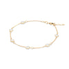Personalized cable chain bracelet featuring six 4 mm briolette cut gemstones bezel set in 14k yellow gold - angled view
