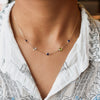 Woman wearing a Grand & Classic 14k gold 1.17 mm cable chain necklace featuring three 4 mm & two 6 mm briolette cut gemstones