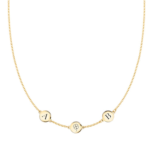 14k gold necklace featuring three 1/4” flat discs, one engraved with a four leaf clover, two with letters - front view