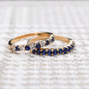 Pair of Rosecliff stackable rings featuring round cut sapphires, one with alternating diamonds, prong set in 14k yellow gold