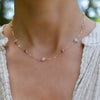 Woman wearing a Bayberry Grand & Classic 14k gold necklace featuring alternating 4 mm & 6 mm pink tourmalines & pink opals