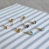Birthstone stud earrings with birthstones of various colors