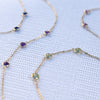Multiple Bayberry cable chain birthstone bracelets each featuring three 4 mm briolette gemstones bezel set in 14k yellow gold