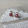 Pair of 14k yellow gold Greenwich 1 Birthstone earrings each featuring one 4 mm ruby and one 2.1 mm diamond