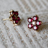 Pair of 14k yellow gold Greenwich 5 Birthstone earrings each featuring five 4 mm rubies and one 2.1 mm diamond