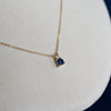 Greenwich cable chain necklace featuring one 4 mm faceted round sapphire and one 2.1 mm diamond bezel set in 14k yellow gold