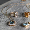 Assorted jewelry including a Warren ring with accent diamonds featuring one emerald cut white topaz bezel set in 14k gold 