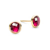 Pair of 14k yellow gold Grand stud earrings each featuring one 6 mm briolette cut bezel set pink ruby - front view