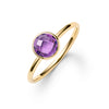 1.6 mm wide 14k yellow gold Grand ring featuring one 6 mm briolette cut bezel set amethyst - angled view