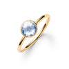 1.6 mm wide 14k yellow gold Grand ring featuring one 6 mm briolette cut bezel set aquamarine - angled view
