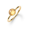 1.6 mm wide 14k yellow gold Grand ring featuring one 6 mm briolette cut bezel set citrine - angled view