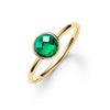 1.6 mm wide 14k yellow gold Grand ring featuring one 6 mm briolette cut bezel set emerald - angled view