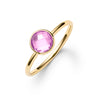 1.6 mm wide 14k yellow gold Grand ring featuring one 6 mm briolette cut bezel set pink sapphire - angled view