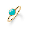 1.6 mm wide 14k yellow gold Grand ring featuring one 6 mm briolette cut bezel set turquoise - angled view