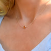 Woman with a Grand 14k yellow gold 1.17 mm cable chain necklace featuring one 6 mm briolette cut bezel set citrine