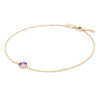 Grand 1.17 mm cable chain bracelet in 14k yellow gold featuring one 6 mm briolette cut bezel set amethyst - angled view