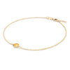 Grand 1.17 mm cable chain bracelet in 14k yellow gold featuring one 6 mm briolette cut bezel set citrine - angled view