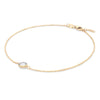 Grand 1.17 mm cable chain bracelet in 14k yellow gold featuring one 6 mm briolette cut bezel set moonstone - angled view