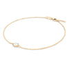 Grand 1.17 mm cable chain bracelet in 14k yellow gold featuring one 6 mm briolette cut bezel set white topaz - angled view