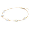 Grand 1.17 mm cable chain bracelet in 14k yellow gold featuring five 6 mm briolette cut bezel set gemstones - angled view