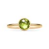 1.6 mm wide 14k yellow gold Grand ring featuring one 6 mm briolette cut bezel set peridot - front view