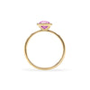 1.6 mm wide 14k yellow gold Grand ring featuring one 6 mm briolette cut bezel set pink sapphire - standing view