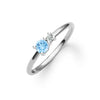 Greenwich ring featuring one 4 mm round cut Nantucket blue topaz and one 2.1 mm diamond prong set in 14k white gold