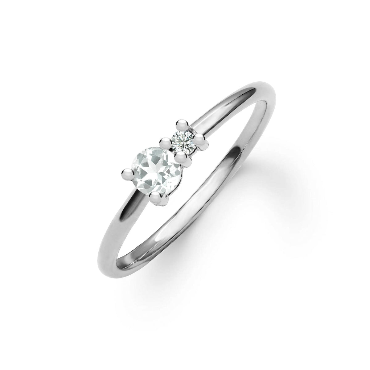 Greenwich ring featuring one 4 mm faceted round cut white topaz and one 2.1 mm diamond prong set in 14k white gold