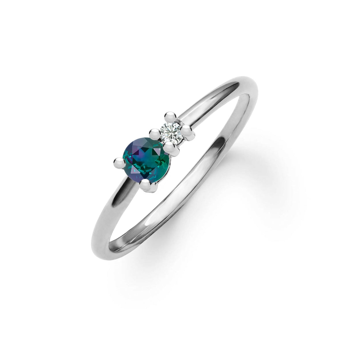 Greenwich ring featuring one 4 mm faceted round cut alexandrite and one 2.1 mm diamond prong set in 14k white gold
