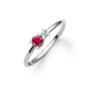 Greenwich ring featuring one 4 mm faceted round cut ruby and one 2.1 mm diamond prong set in 14k white gold