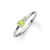 Greenwich ring featuring one 4 mm faceted round cut peridot and one 2.1 mm diamond prong set in 14k white gold