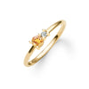 Greenwich ring featuring one 4 mm faceted round cut citrine and one 2.1 mm diamond prong set in 14k gold - angled view