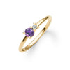 Greenwich ring featuring one 4 mm faceted round cut amethyst and one 2.1 mm diamond prong set in 14k gold - angled view
