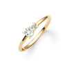 Greenwich ring featuring one 4 mm faceted round cut white topaz and one 2.1 mm diamond prong set in 14k gold - angled view