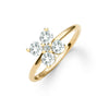 Greenwich ring featuring four 4 mm faceted round cut white topaz and one 2.1 mm diamond prong set in 14k gold - angled view