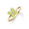 Greenwich ring featuring four 4 mm faceted round cut peridots and one 2.1 mm diamond prong set in 14k gold - angled view