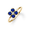 Greenwich ring featuring four 4 mm faceted round cut sapphires and one 2.1 mm diamond prong set in 14k gold - angled view