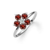 Greenwich ring featuring five 4 mm faceted round cut garnets and one 2.1 mm diamond prong set in 14k white gold