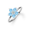 Greenwich ring featuring five 4 mm round cut Nantucket blue topaz and one 2.1 mm diamond prong set in 14k white gold
