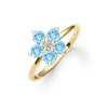 Greenwich ring featuring five 4 mm round cut Nantucket blue topaz and one 2.1 mm diamond prong set in 14k gold - angled view