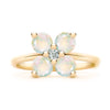 Greenwich ring featuring four 4 mm faceted round cut opals and one 2.1 mm diamond prong set in 14k gold - front view